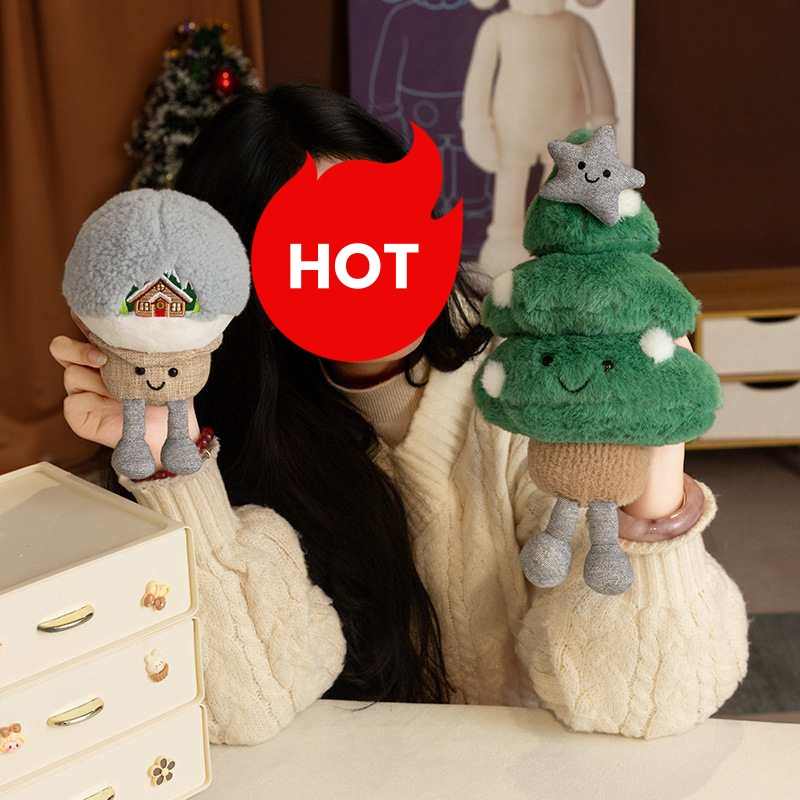 Girl holding a winter snow cabin globe and a Christmas tree stuffed animal with dangling legs for bulk vendors.