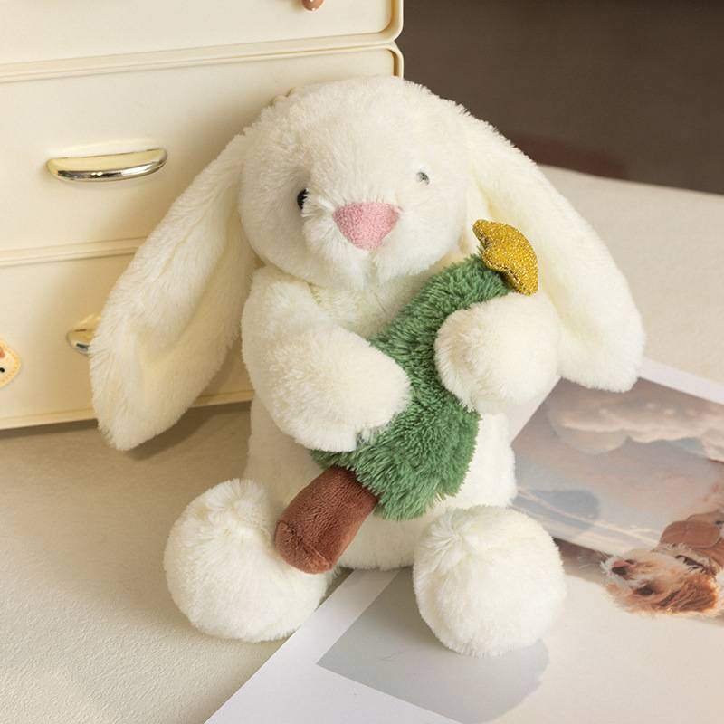 Ready stock white bunny rabbit stuffed toy holding a mini pine tree on a white background for wholesale.
