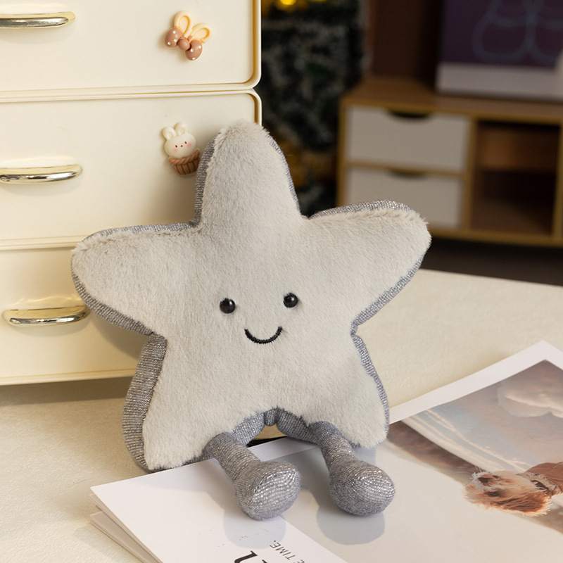 Wholesale aesthetic grey star plush cushion with a smiling face and dangling legs for B2B.