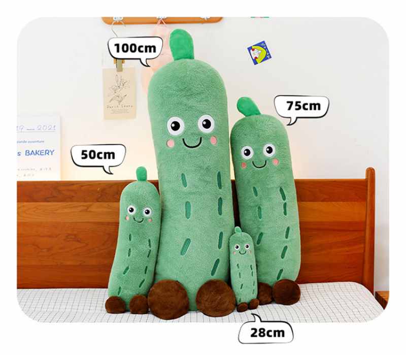 Size chart for cute cucumber plush toys displaying 28cm, 50cm, 75cm, and 100cm options on a bed, wholesale emotional support stuffed pillows.