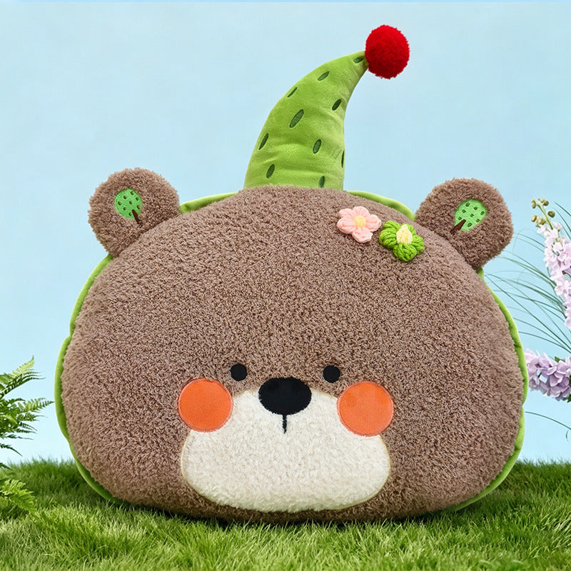 Cute bear plush pillow with green party hat, aesthetic room decor.