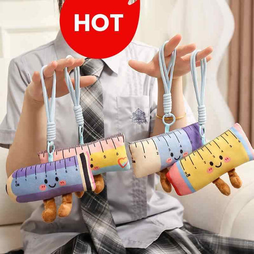 Student in aesthetic school uniform holding cute pastel ruler plush keychains, perfect back to school gift ideas.