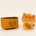 Wholesale classic orange cat plush with bread basket for boutique retail.