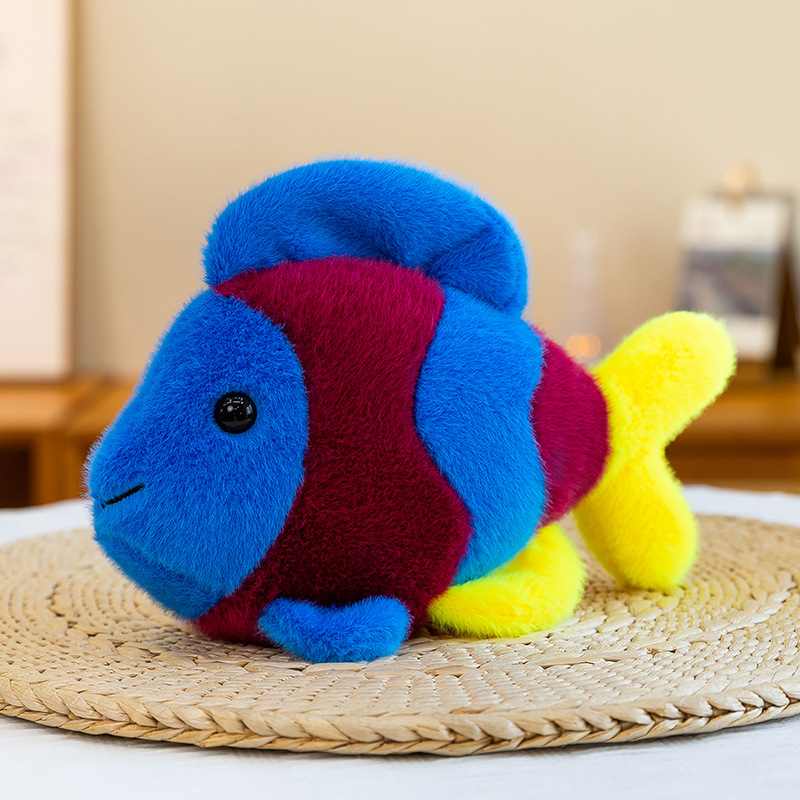 B2B colorful dark blue and yellow aquarium fish plush doll on a woven mat for global sourcing.