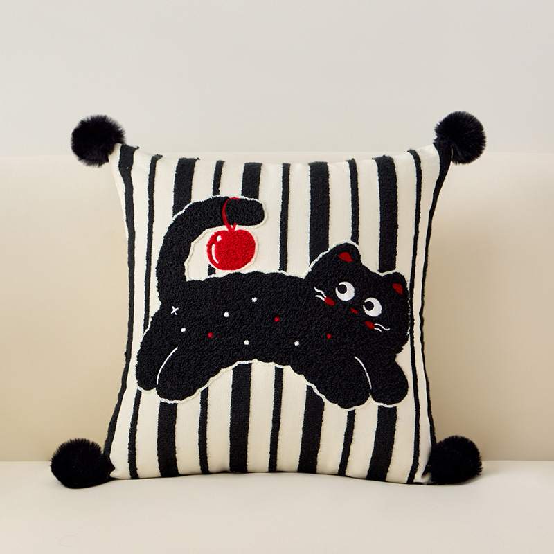 B2B striped black cat tufted pillow playing with a red ball, ideal for home decor distributors.