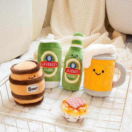 Barcade decor display featuring beer barrel, can, bottle, and mug stuffed animals in a metal wire basket.