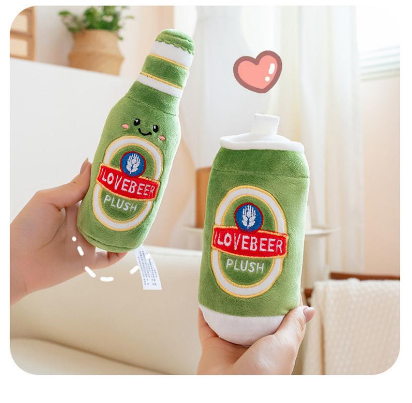 Hands holding a cute green beer bottle and beer can plush toy to demonstrate their actual size and soft texture.