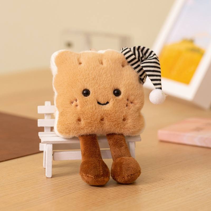 Boutique supply kawaii sleepy biscuit soft plush toy with dangling legs sitting on a miniature wooden chair.