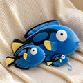 Boutique supply ocean animal blue fish plush toy and mini keychain pendant on a cozy blanket.