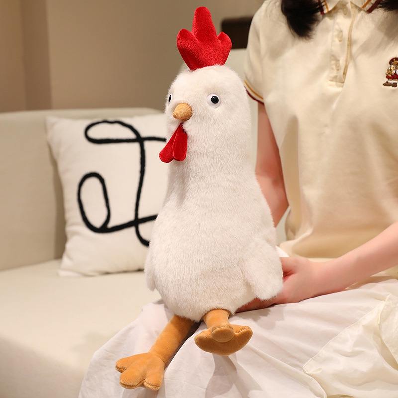 White long chicken plush toy sitting on a girl's lap for boutique wholesale supply.