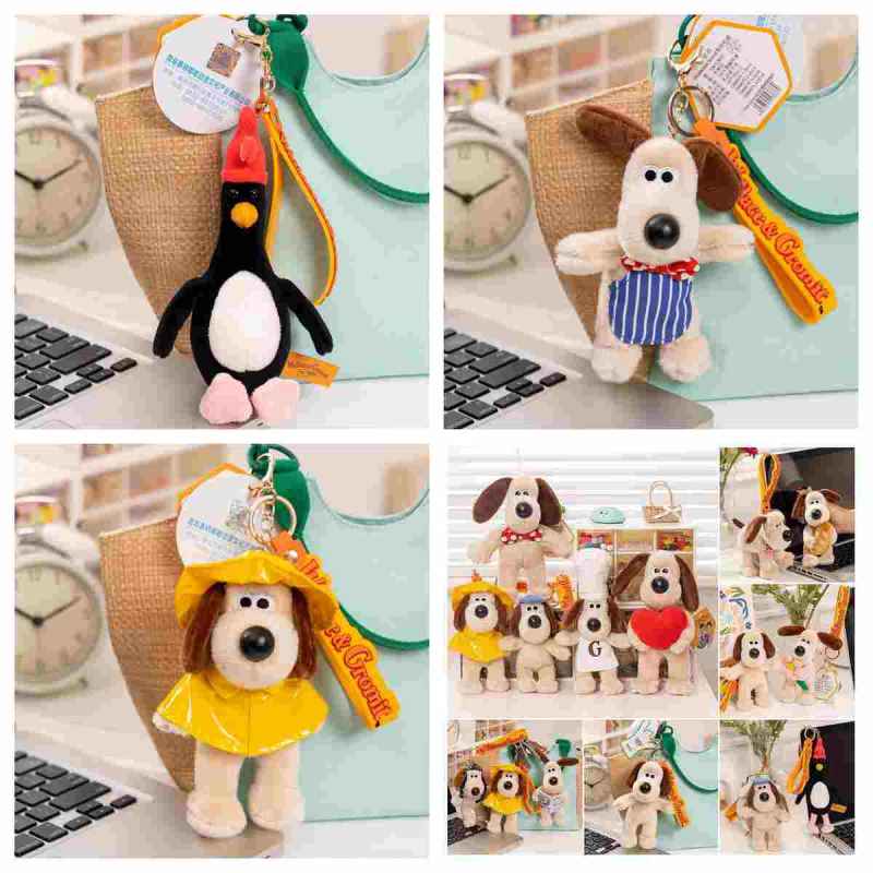 Bulk custom cartoon dog and penguin bag charms in yellow raincoats and bowties for boutique vendors.