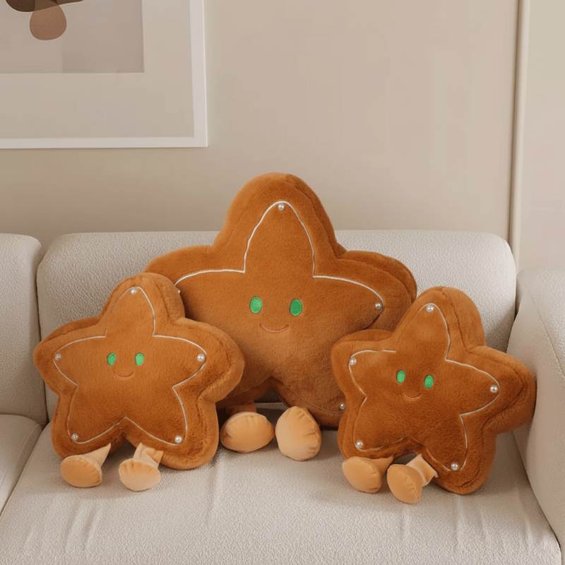 Bulk custom gingerbread star plush cushions in three sizes on sofa for home decor vendors.