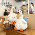 Bulk custom white goose soft toys styled with wicker basket for home and nursery decor wholesale.