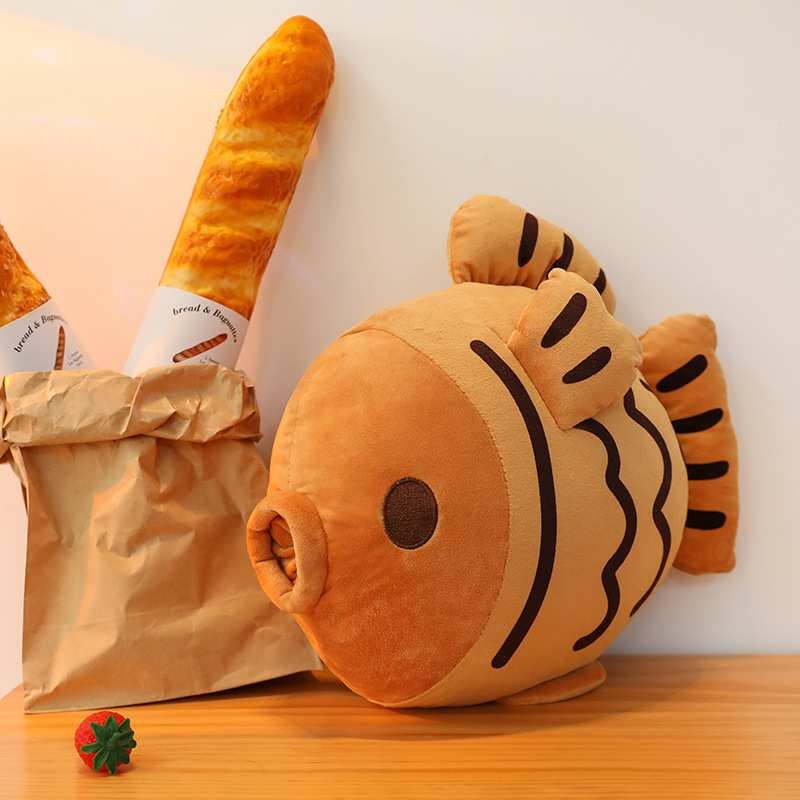 Bulk custom Japanese taiyaki cushion on table with bread bag for boutique gift shop suppliers.