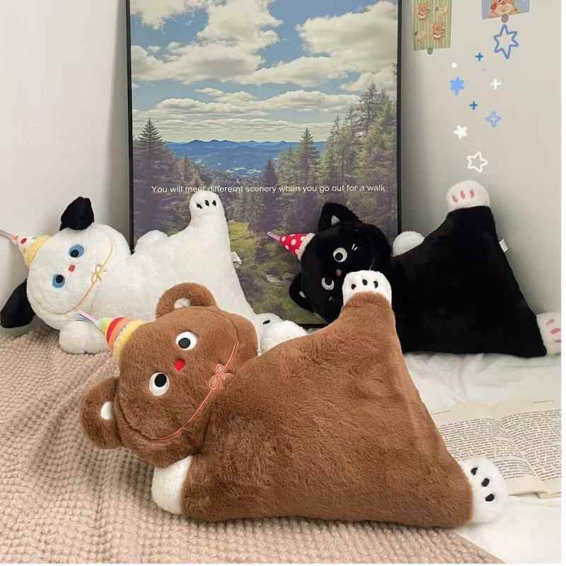 Bulk custom party hat animal stuffed cushion pillows displayed on a bed for wholesale home decor vendors.