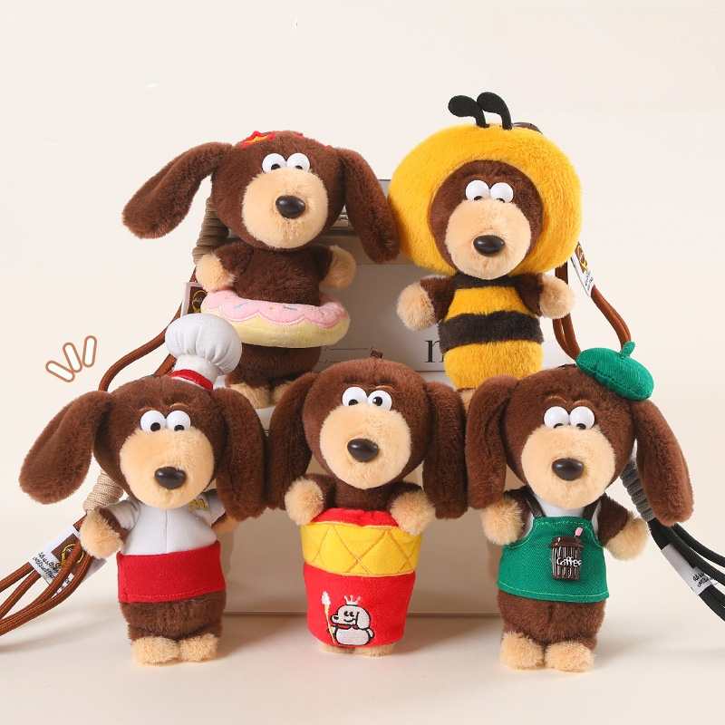Bulk custom sausage dog bag charms in various outfits displayed for boutique retail vendors.