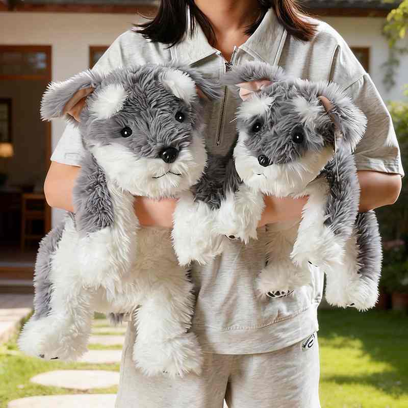 Bulk custom Schnauzer plush factory sourcing display showing two realistic dogs held by model.