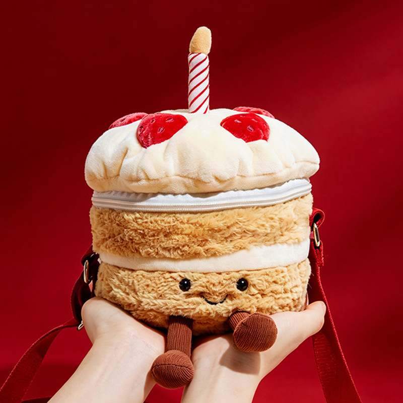 Premium plush birthday cake shoulder bag featuring a striped candle and strawberries for boutique suppliers.