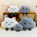 Bulk custom weather cloud cushions in multiple sizes displayed on wooden cabinet for retail vendors.