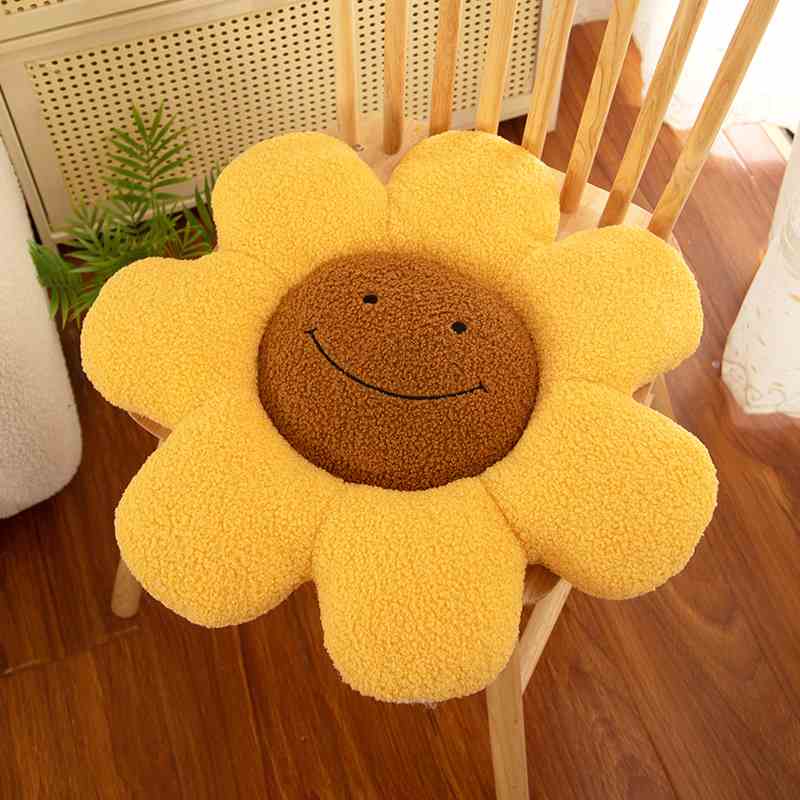 Bulk custom yellow sunflower floor pillow cushion on wooden chair for retail vendors.