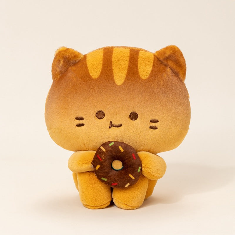 Bulk donut-holding cat plush toy for arcade crane machines and prizes.