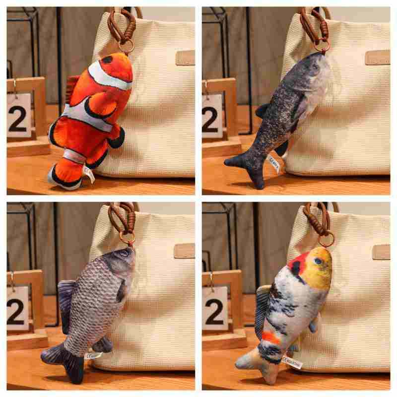 Wholesale realistic fish plush bag charm assortment featuring vibrant reef fish, ideal for aquarium gift shop displays.