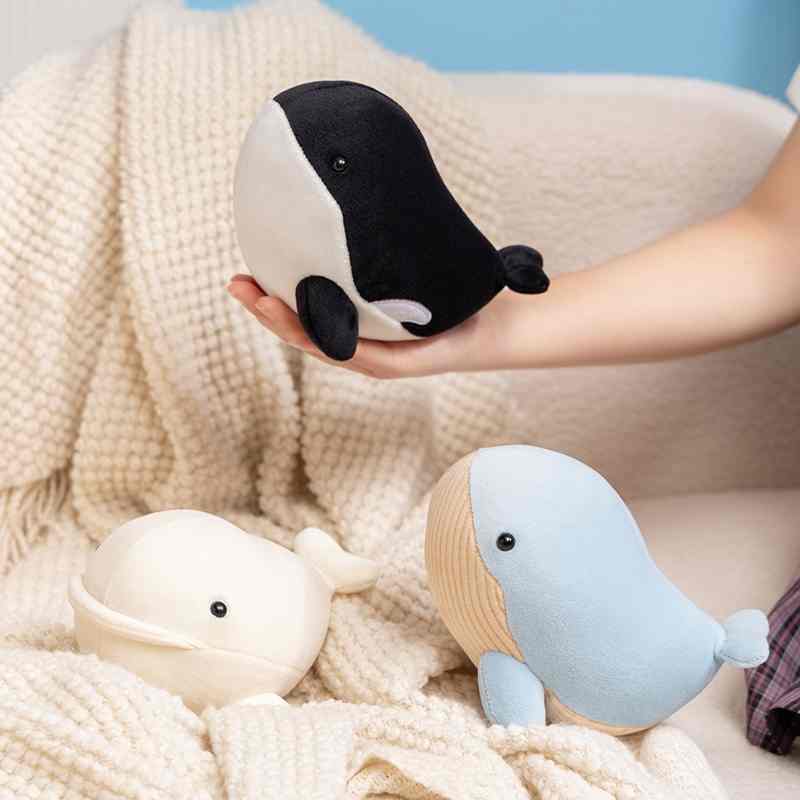 Bulk ocean animal stuffed toys including killer whale and white whale, a high-turnover item for toy distributors.