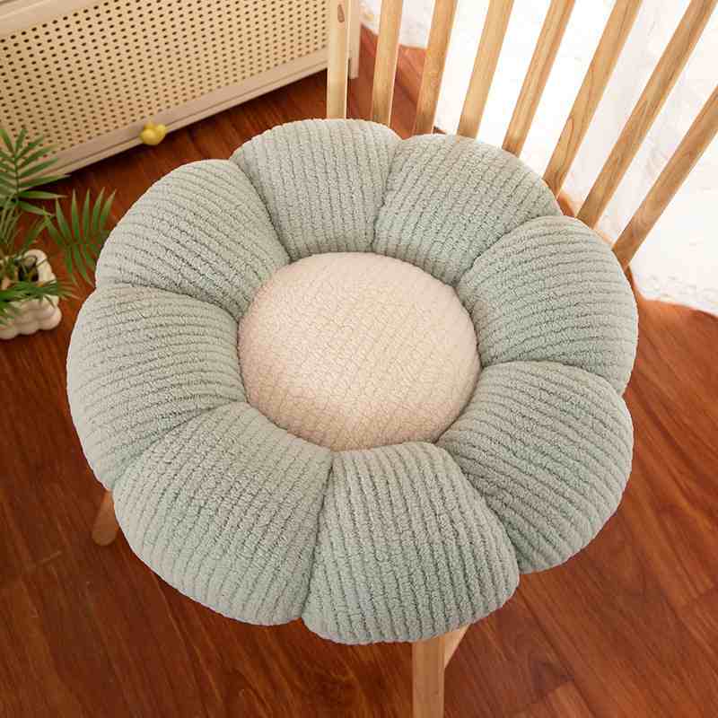 Bulk pastel green flower cushion on wooden chair for home decor suppliers.
