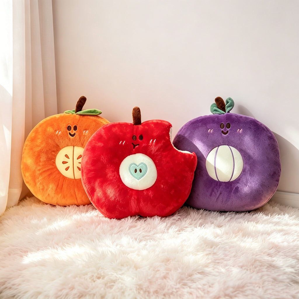 Bulk stuffed apple, orange, and grape plushies sitting on a furry rug, perfect for lifestyle gift shop distributors.