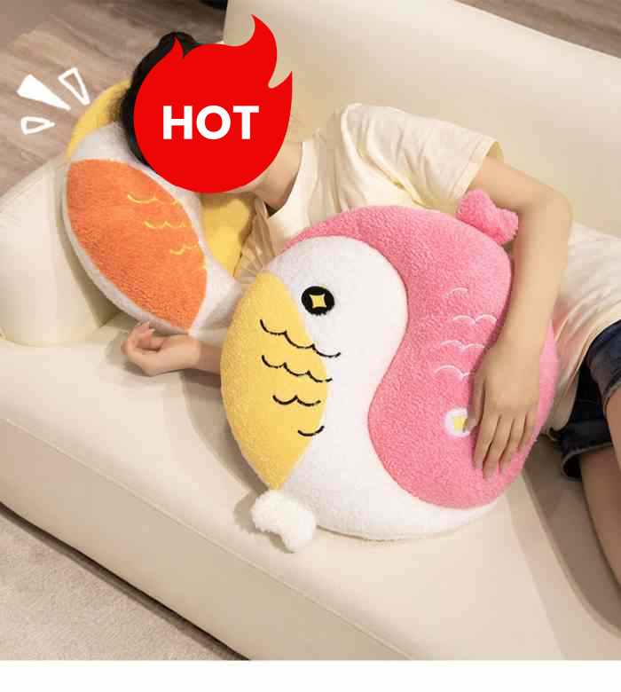 Girl comfortably sleeping on a sofa hugging the ultra-soft pink kawaii Yin Yang fish plush pillow.