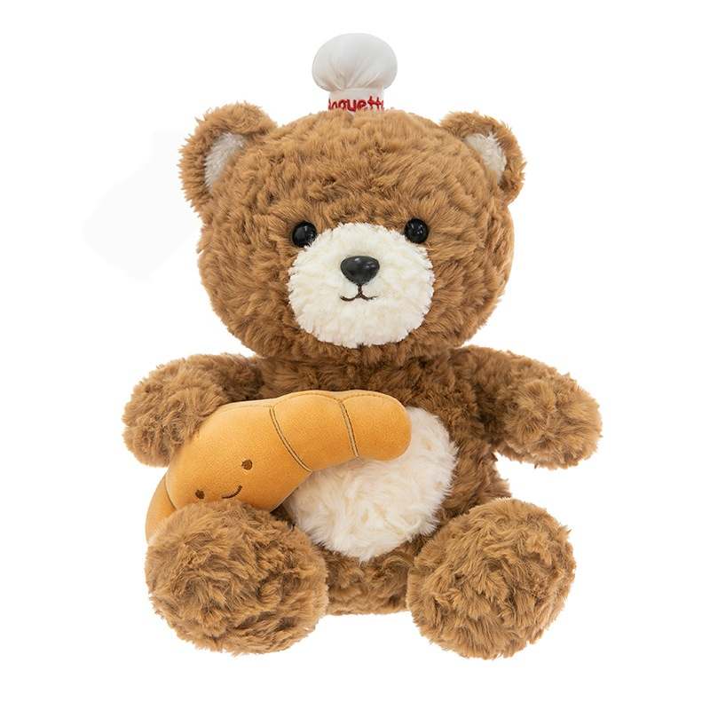 Custom bakery stuffed bear with croissant on white background for private label OEM manufacturing.
