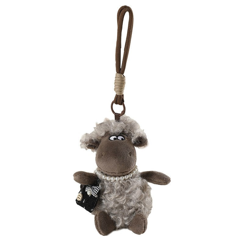 Mini lamb plush pendant with pearl necklace and crossbody bag isolated on white background for OEM manufacturer.