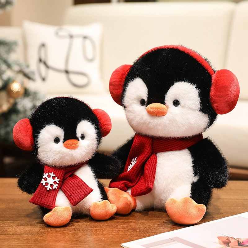 Custom OEM penguin plush toy family sitting on a table, perfect for holiday gift sourcing.
