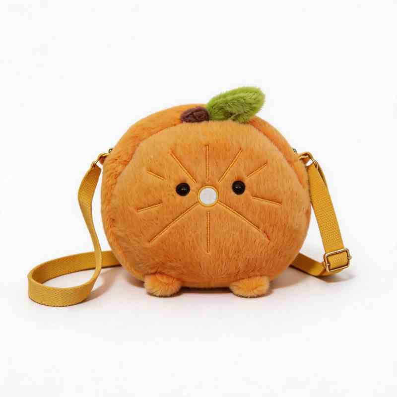 Custom orange fruit stuffed shoulder bag with adjustable strap on white background, ideal for private label sourcing partners.