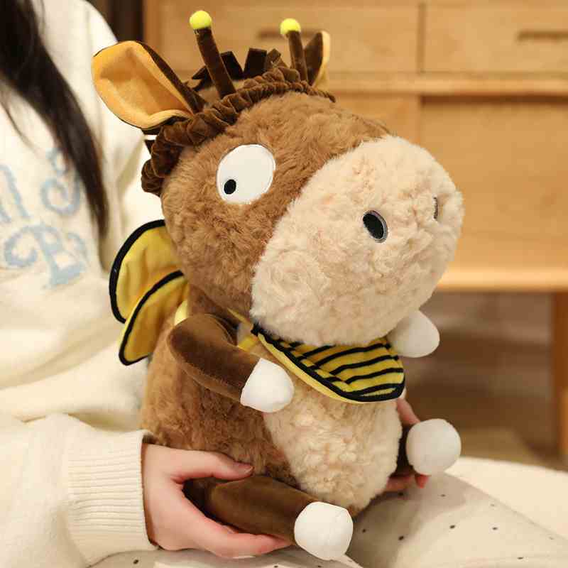Lifestyle view of soft plush donkey doll in bee outfit held by a person