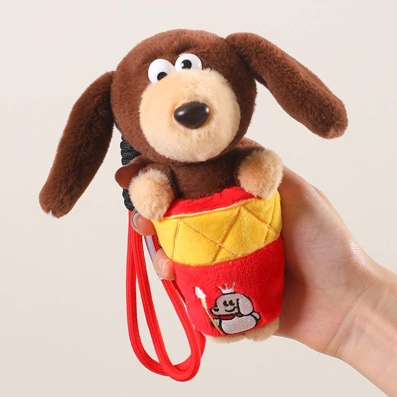 Custom sausage dog stuffed toy plush keychain held in hand, ideal for private label OEM manufacturing.