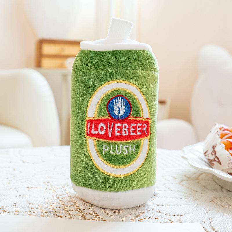 Close-up of a cute green beer can plush toy with a smiling face and embroidered I LOVE BEER label.