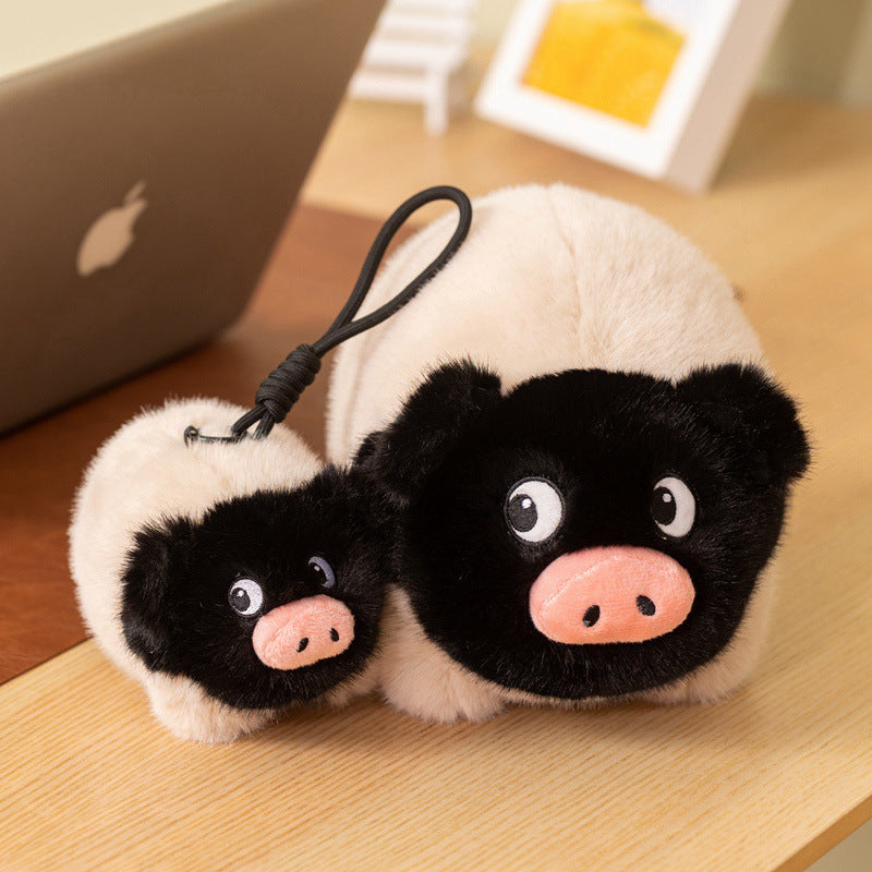 Two sizes of soft piggy stuffed animals, a large hugging plush and a mini pig toy, unique gift ideas for plushie lovers.
