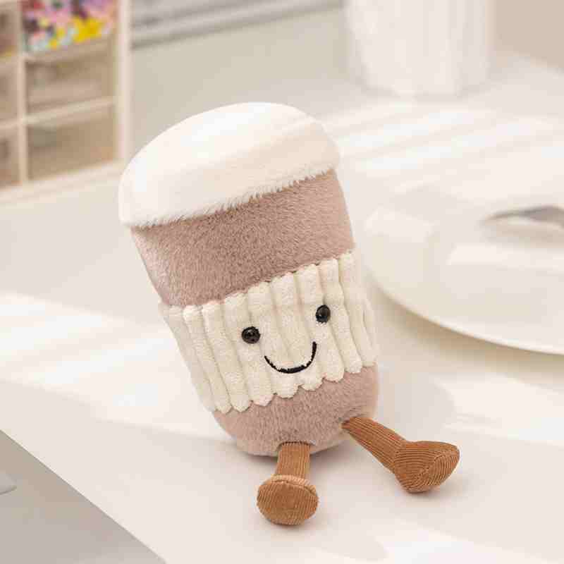 Cute coffee cup soft toy with detailed embroidered facial features, tailored for boutique nursery and cafe decor wholesale.