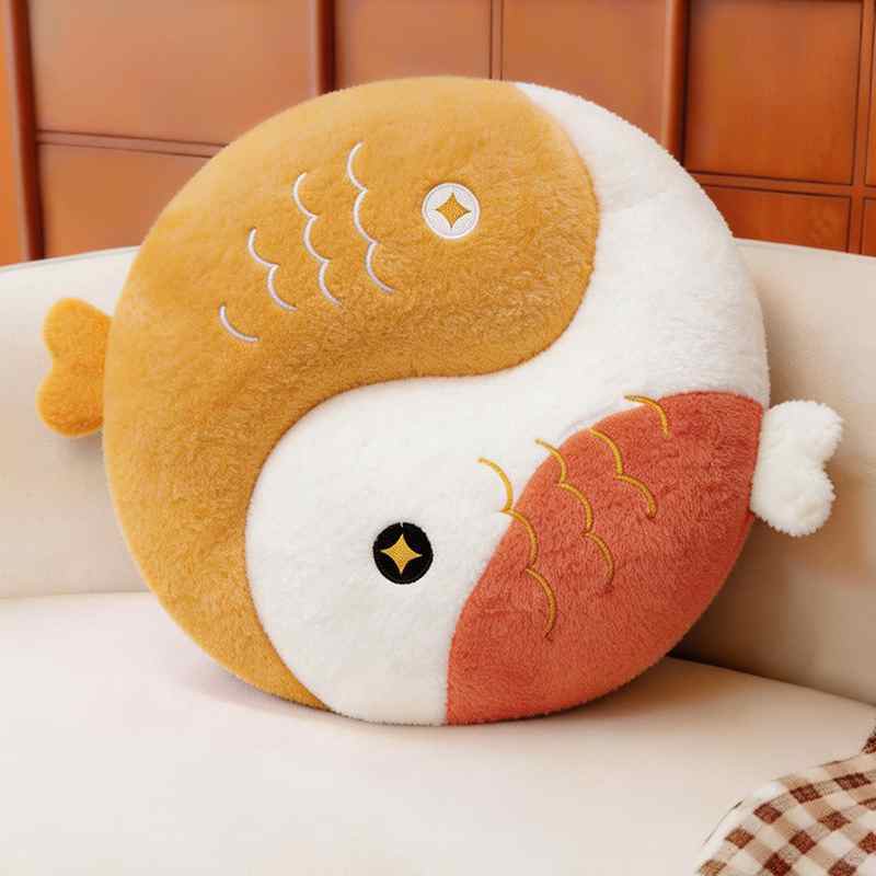 Bright lemon yellow and white Yin Yang fish plush cushion forming a Tai Chi symbol.