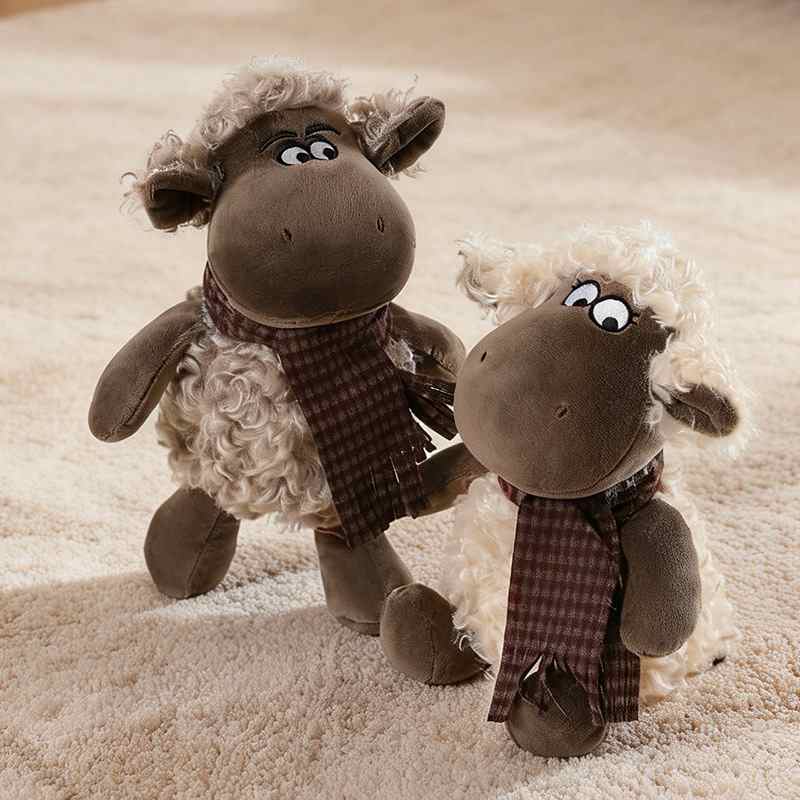 Pair of fluffy aesthetic sheep soft plush toys sitting on a rug for factory-direct wholesale.