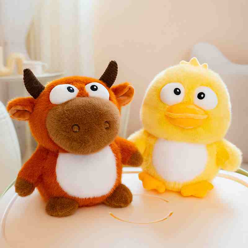 Factory-direct cute cow and duck plushies displayed together, perfect for novelty boutique and lifestyle gift shop retail supply.