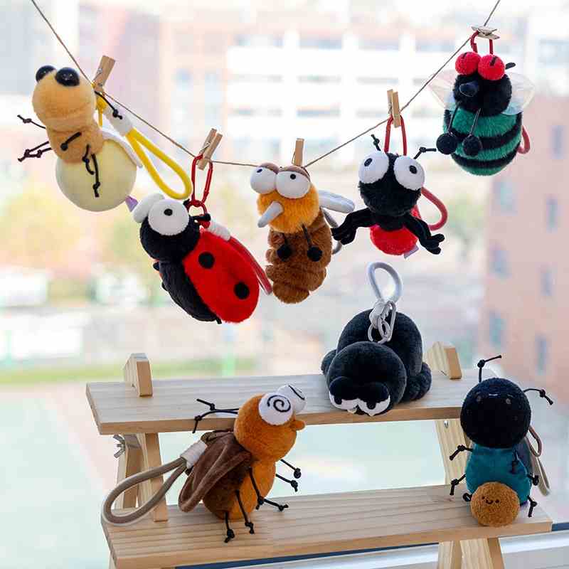 Factory-direct cute insect plush pendants hanging on a line, perfect for gift shop and bookstore impulse buys.