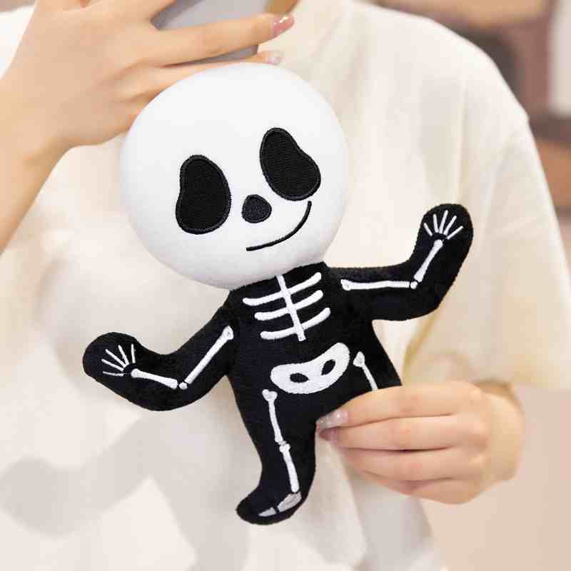Factory-direct cute skeleton plush doll held by a model, showcasing size and premium material quality for custom plush vendors.