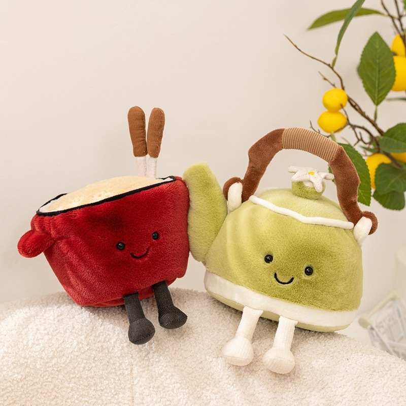 Red ramen noodle bowl plush and smiling green teapot plush sitting together for factory-direct sourcing.