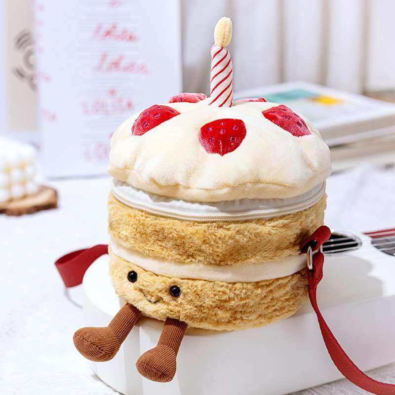 Factory-direct novelty food plush purse shaped like a cake sitting on a desk for lifestyle accessories sourcing.