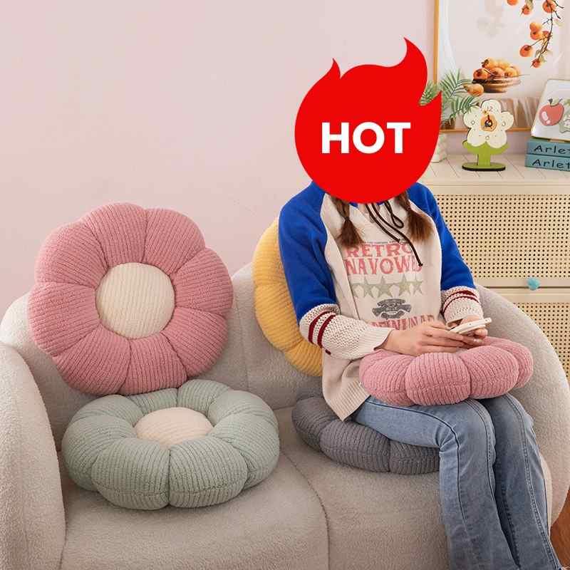 High-ROI aesthetic floral floor cushions on sofa with model, optimized for retail distributors.