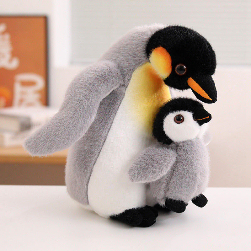 High-ROI aquarium souvenir penguin soft toy in a realistic parent-baby hugging pose, maximizing impulse-buy appeal for global wholesale.