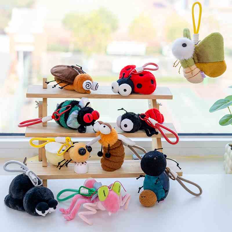 High-ROI novelty bug plush keyrings displayed on a shelf for toy store and supermarket wholesale supply.