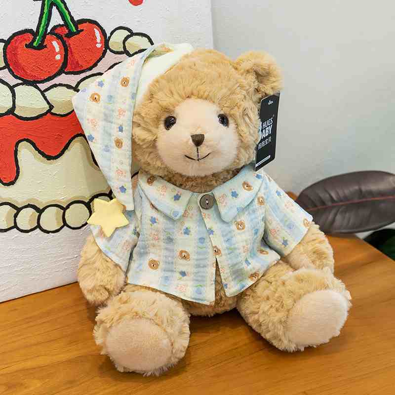 High-ROI nursery decor bear plush in sleepwear, maximizing visual merchandising appeal for baby boutique retail distributors.